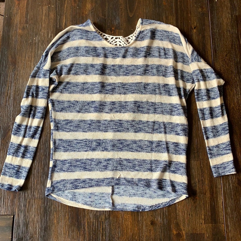 Striped lightweight sweater with detailed back.